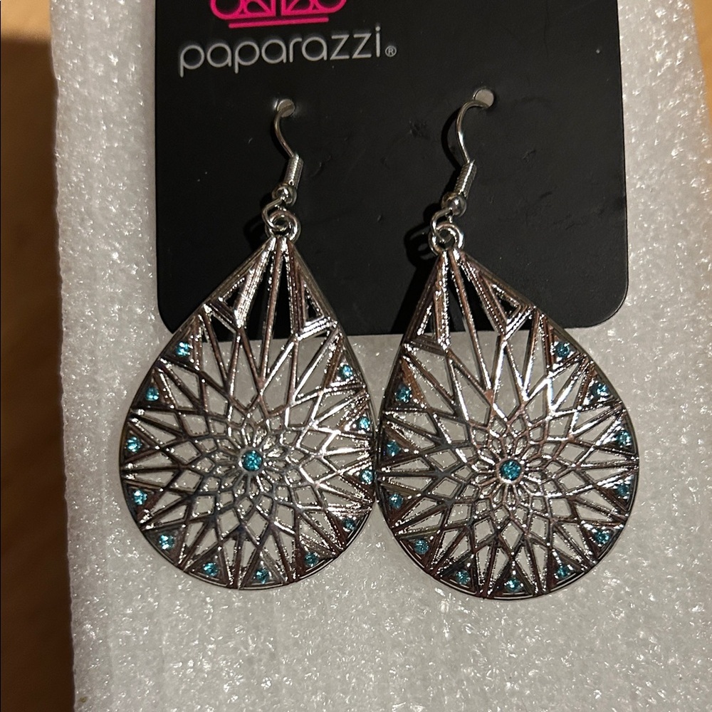 Brand new! Silver dangly earrings w/blue stones